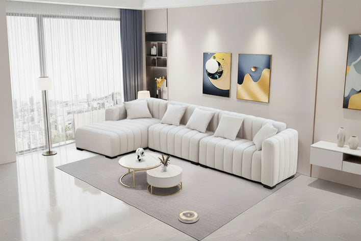 Sofá modular tapizado en terciopelo con capitoné y chaise longue izquierda