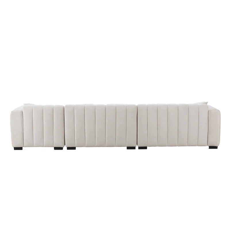 Sofá modular tapizado en terciopelo con capitoné y chaise longue izquierda