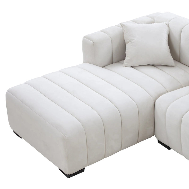 Sofá modular tapizado en terciopelo con capitoné y chaise longue izquierda